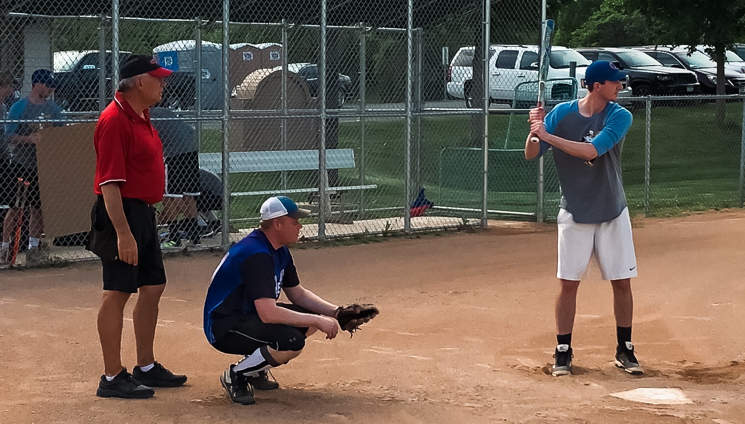 Adult softball player at bat.